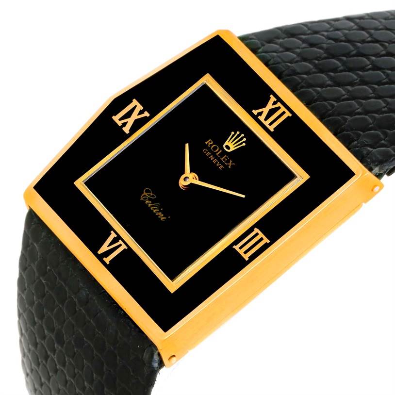 The Rolex Cellini 4153 Men's Yellow Gold Black Dial 4153 Men's Yellow Gold Black Dial watch is shown at a slight angle, highlighting its square face, black Roman numeral markers, and black leather strap.