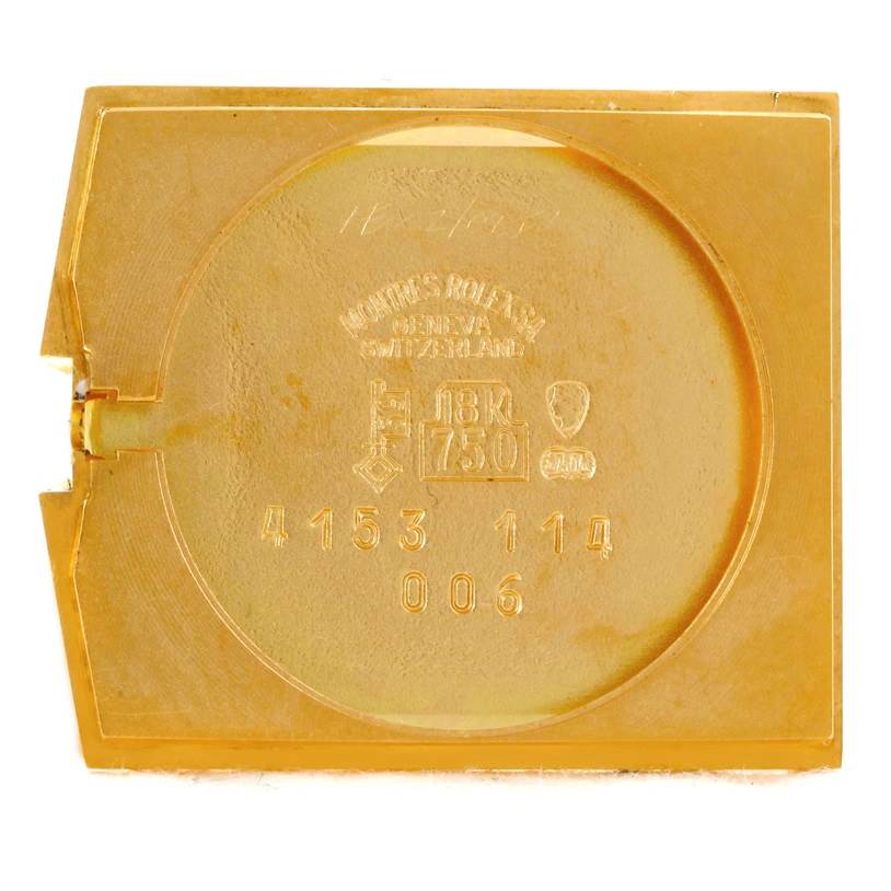 This is an aerial view of the inside back cover of a Rolex Cellini 4153 Men's Yellow Gold Black Dial 4153 Men's Yellow Gold Black Dial watch, revealing engraving and hallmarks.