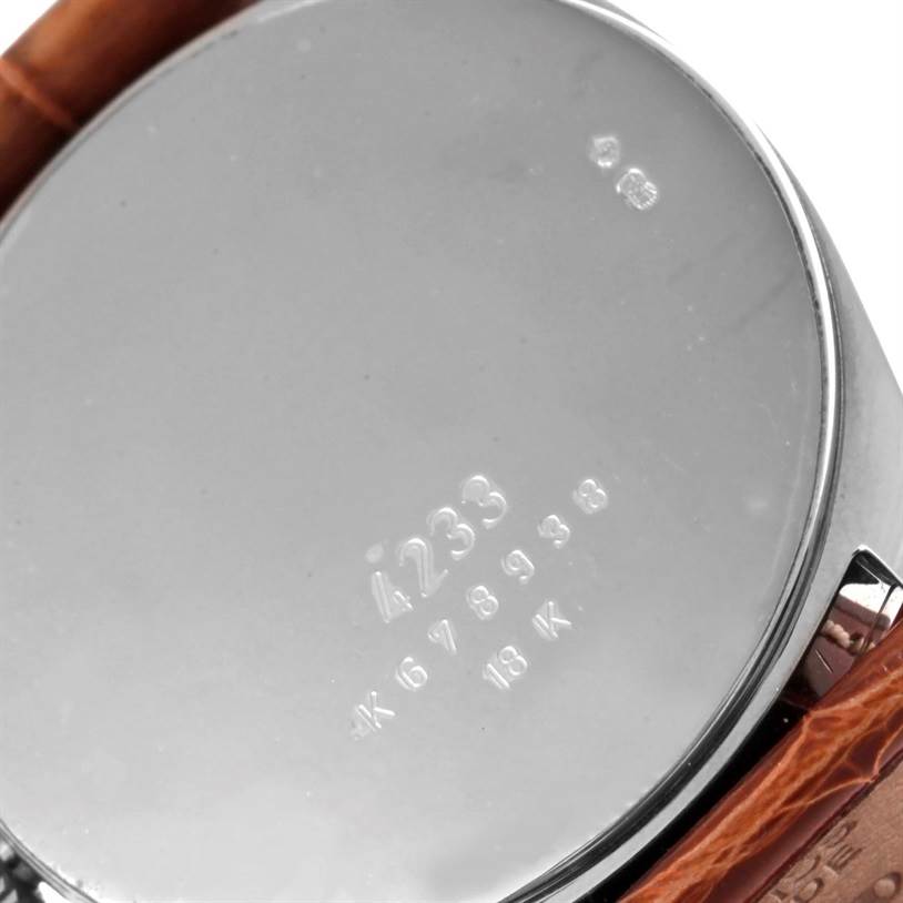 This image shows the back case and part of the strap of the Rolex Cellini 4233 Men's White Gold Black Dial 4233 Men's White Gold Black Dial watch, displaying its model number and material details.