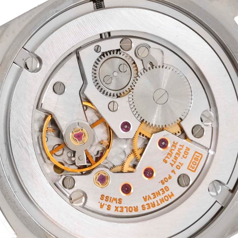 This image shows a close-up of the mechanical movement of the Rolex Cellini 4233 Men's White Gold White Dial 4233 Men's White Gold White Dial model watch, focusing on its intricate gears and components.