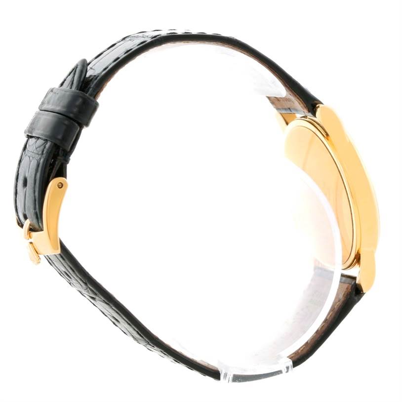 The image shows a side profile of the Rolex Cellini 5116 Men's Yellow Gold Beige Dial 5116 Men's Yellow Gold Beige Dial watch, highlighting its leather strap and gold case edge.