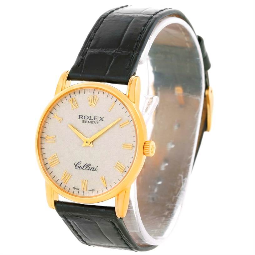The image shows a Rolex Cellini 5116 Men's Yellow Gold Beige Dial 5116 Men's Yellow Gold Beige Dial watch at a three-quarter angle highlighting the face, gold bezel, crown, and black leather strap.