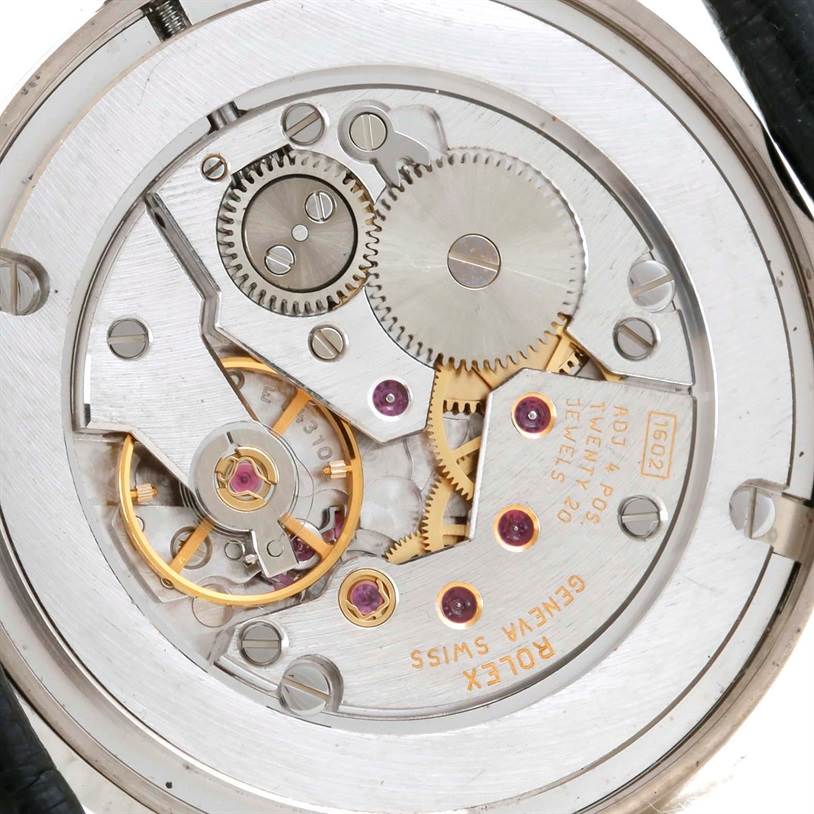 The image shows a close-up of the movement and internal mechanisms of a Rolex Cellini 5115 Men's White Gold Silver Dial 5115 Men's White Gold Silver Dial watch.