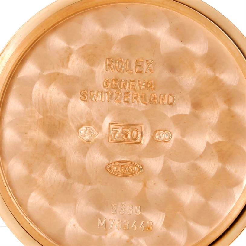 This image shows the inner case back of a Rolex Cellini 5330 Men's Rose Gold Grey Dial 5330 Men's Rose Gold Grey Dial watch with stamped markings and specifications.