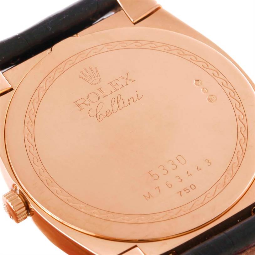 The image shows the back case of a Rolex Cellini 5330 Men's Rose Gold Grey Dial 5330 Men's Rose Gold Grey Dial watch, angled to display the engraved details and crown.