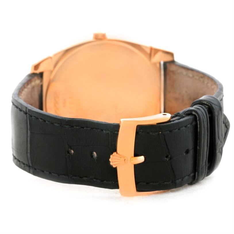 This image shows the back of a Rolex Cellini 5330 Men's Rose Gold Grey Dial 5330 Men's Rose Gold Grey Dial watch, focusing on the leather strap and gold buckle.