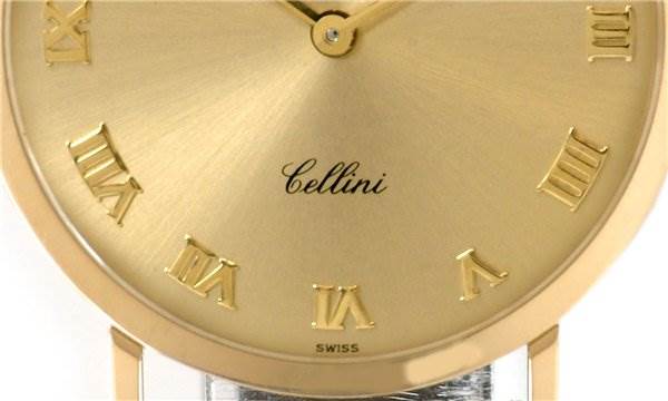 Close-up of the Rolex Cellini 4112 Men's Yellow Gold Champagne Dial 4112 Men's Yellow Gold Champagne Dial watch face showing part of the dial with Roman numeral markers and the "Cellini" inscription.