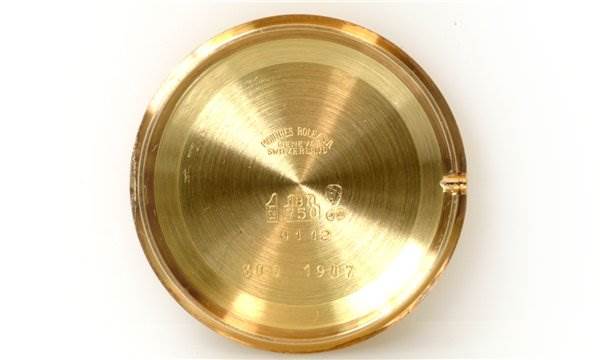 This image shows the inside of the case back of a Rolex Cellini 4112 Men's Yellow Gold Champagne Dial 4112 Men's Yellow Gold Champagne Dial watch.