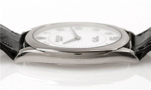 The image shows a side view of the Rolex Cellini 4233/9 Men's White Gold White Dial 4233/9 Men's White Gold White Dial watch, highlighting its case and part of the strap.