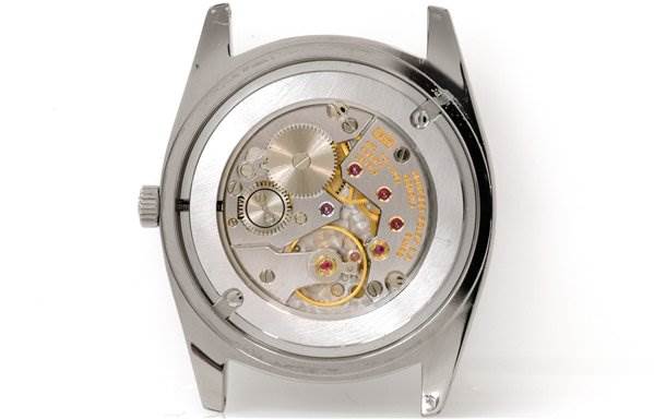 This image shows a rear view of a Rolex Cellini 4233/9 Men's White Gold White Dial 4233/9 Men's White Gold White Dial watch, highlighting its internal mechanical movement components.