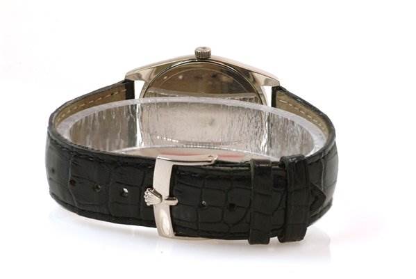 The image shows the back view of a Rolex Cellini 4233/9 Men's White Gold White Dial 4233/9 Men's White Gold White Dial watch, highlighting the black leather strap and metal clasp.