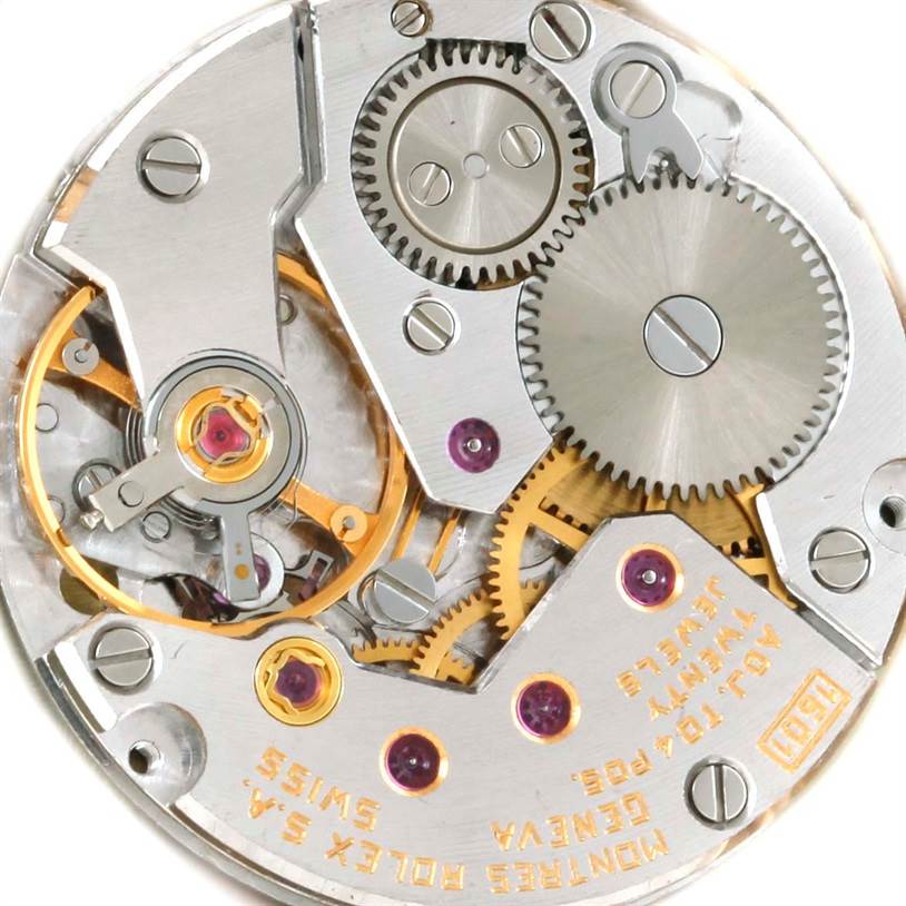 This image shows a close-up angle of the internal movement parts of a Rolex Cellini 4127 Men
s Yellow Gold Champagne Dial 4127 Men
s Yellow Gold Champagne Dial watch.