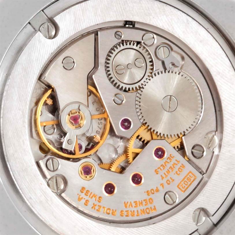 This image showcases the intricate movement and inner mechanics of the Rolex Cellini 4233 Men's White Gold White Dial 4233 Men's White Gold White Dial watch up close.