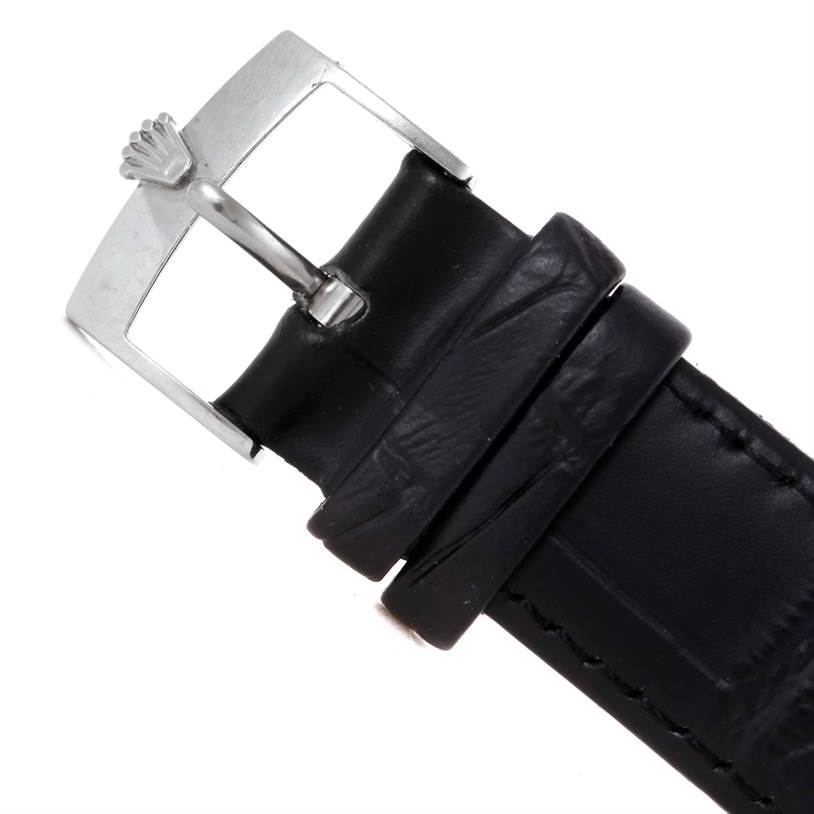 This image shows a close-up of the buckle and part of the leather strap of a Rolex Cellini 4233 Men's White Gold White Dial 4233 Men's White Gold White Dial watch.