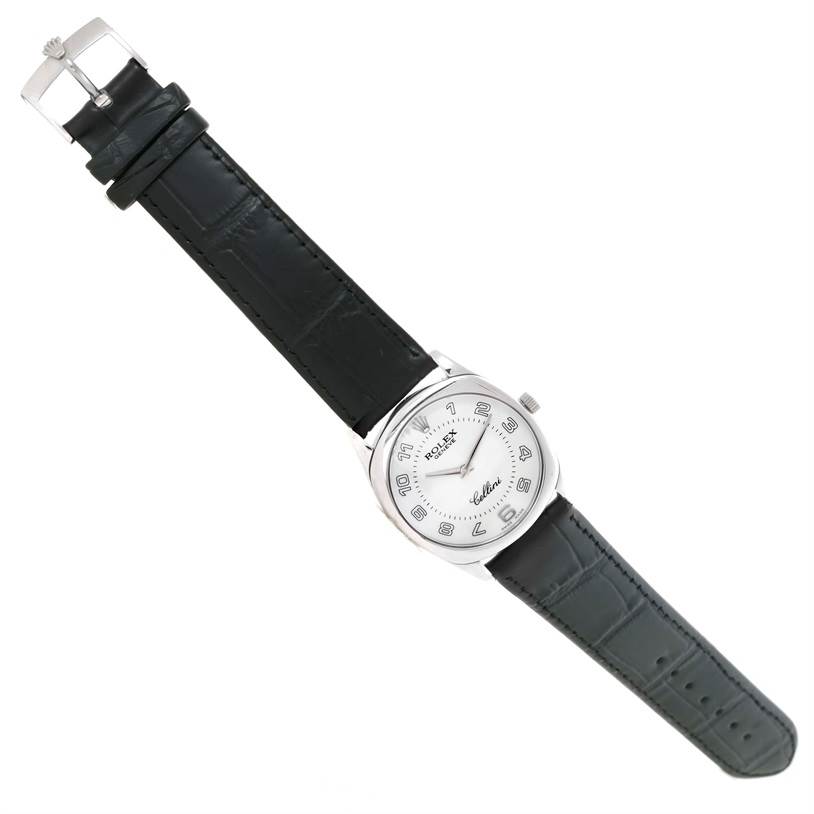 The Rolex Cellini 4233 Men's White Gold White Dial 4233 Men's White Gold White Dial watch is shown at an angled flat lay, displaying the face, black leather strap, and buckle.