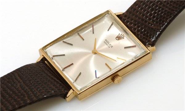 The image shows a Rolex Cellini 3607 Men's Yellow Gold Silver Dial 3607 Men's Yellow Gold Silver Dial watch at a slight angle, featuring its face, gold case, and brown textured strap.
