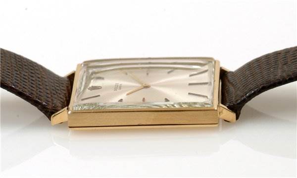 The image shows a side view of a Rolex Cellini 3607 Men's Yellow Gold Silver Dial 3607 Men's Yellow Gold Silver Dial watch, highlighting the case, crystal, and leather straps.