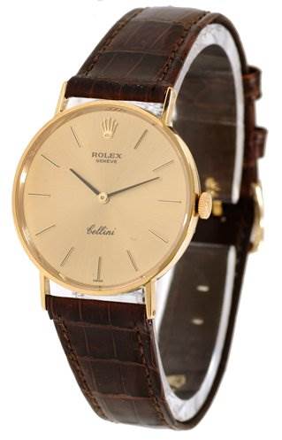 This image shows a Rolex Cellini 3833 Men's Yellow Gold Champagne Dial 3833 Men's Yellow Gold Champagne Dial watch from a frontal angle, highlighting its gold bezel, brown leather strap, and dial.
