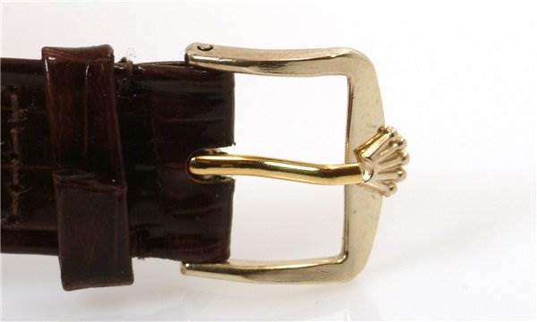 The image shows the buckle and leather strap of a Rolex Cellini 3833 Men's Yellow Gold Champagne Dial 3833 Men's Yellow Gold Champagne Dial watch from a side angle.