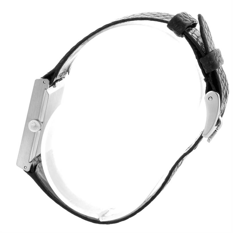 This side view of the Rolex Cellini 4014 Men's White Gold Blue Dial 4014 Men's White Gold Blue Dial model showcases its case, crown, and leather strap with buckle.