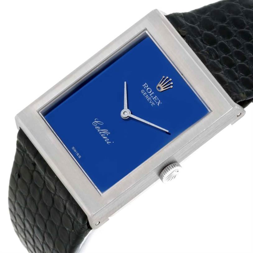 The image shows a close-up angled view of the Rolex Cellini 4014 Men's White Gold Blue Dial 4014 Men's White Gold Blue Dial watch, highlighting its blue dial, rectangular case, and leather strap.