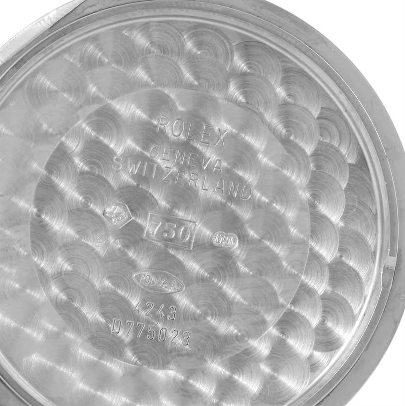 The image displays the interior side of the case back of a Rolex Cellini 4243 Men's White Gold Silver Dial 4243 Men's White Gold Silver Dial watch, showcasing engravings and hallmark stamps.