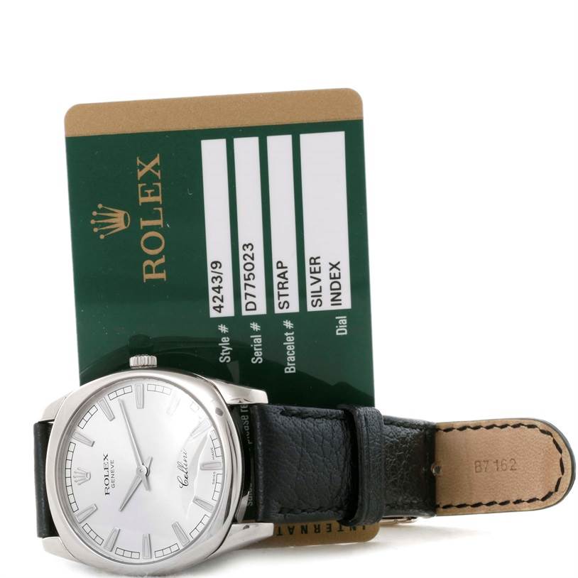 This image shows a Rolex Cellini 4243 Men's White Gold Silver Dial 4243 Men's White Gold Silver Dial watch at a slight angle with its face and strap, alongside the authenticity card.