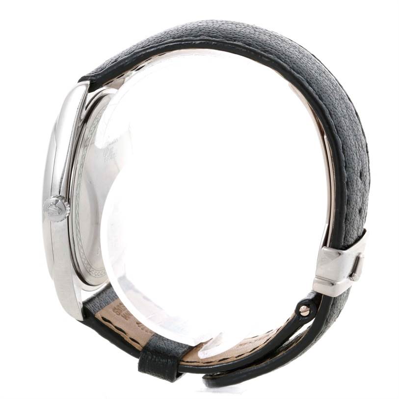 This image of the Rolex Cellini 4243 Men's White Gold Silver Dial 4243 Men's White Gold Silver Dial watch shows a side view of the case and strap joint, highlighting the crown and leather strap.