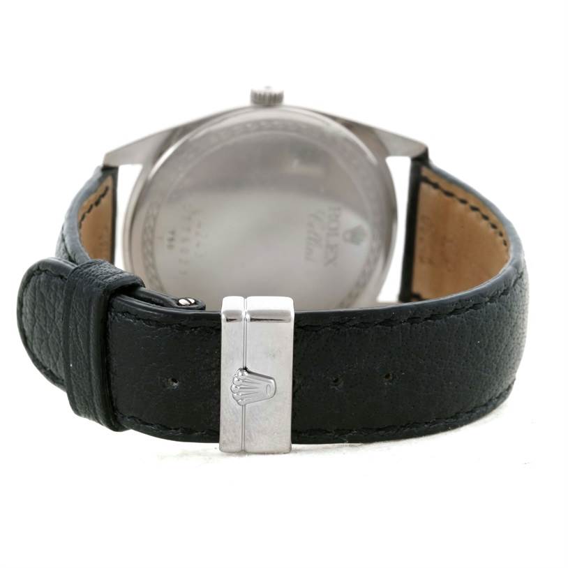 The image shows the back view of a Rolex Cellini 4243 Men's White Gold Silver Dial 4243 Men's White Gold Silver Dial watch, featuring its leather strap and clasp.