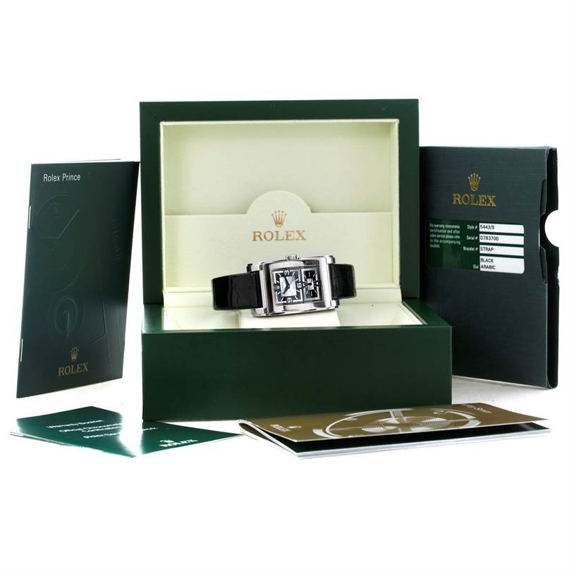 The Rolex Cellini 5443 Men's White Gold Black Dial 5443 Men's White Gold Black Dial watch is displayed front-facing in an open box with accompanying booklets and documents.