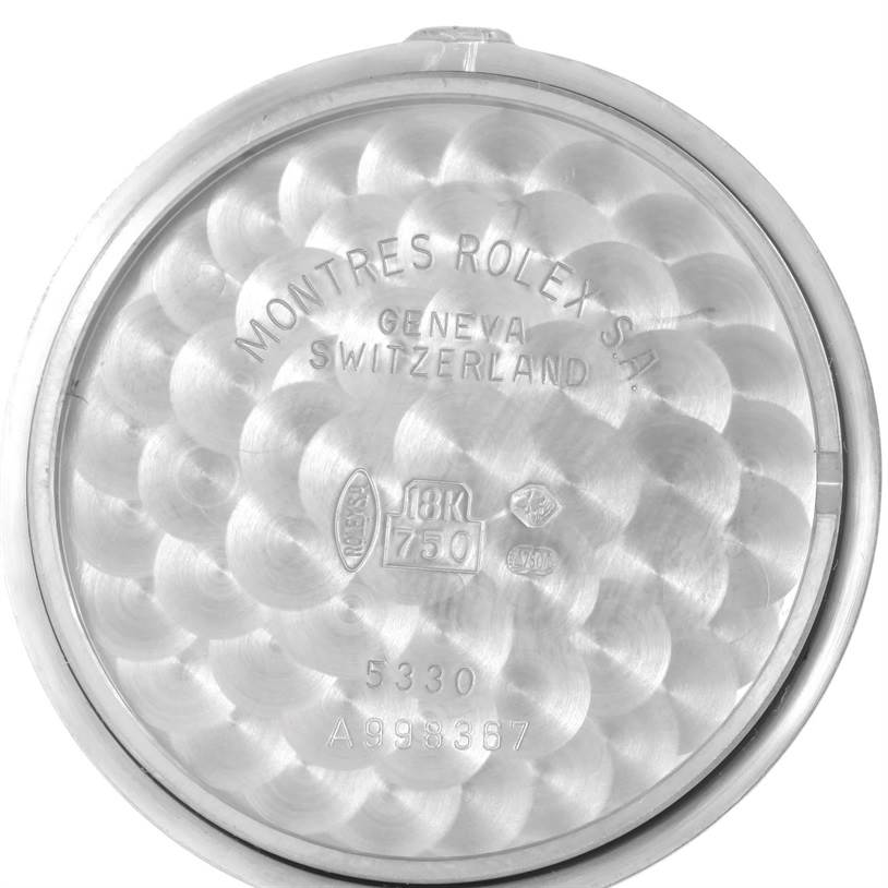 This image shows the inner case back of a Rolex Cellini 5330 Men's White Gold Mother of Pearl Dial 5330 Men's White Gold Mother of Pearl Dial watch with engravings and hallmarks.