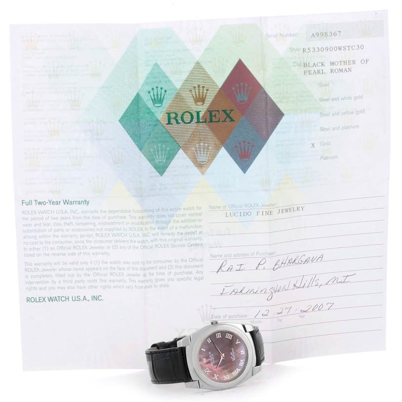 The image shows a Rolex Cellini 5330 Men's White Gold Mother of Pearl Dial 5330 Men's White Gold Mother of Pearl Dial model watch placed in front of its warranty certificate.