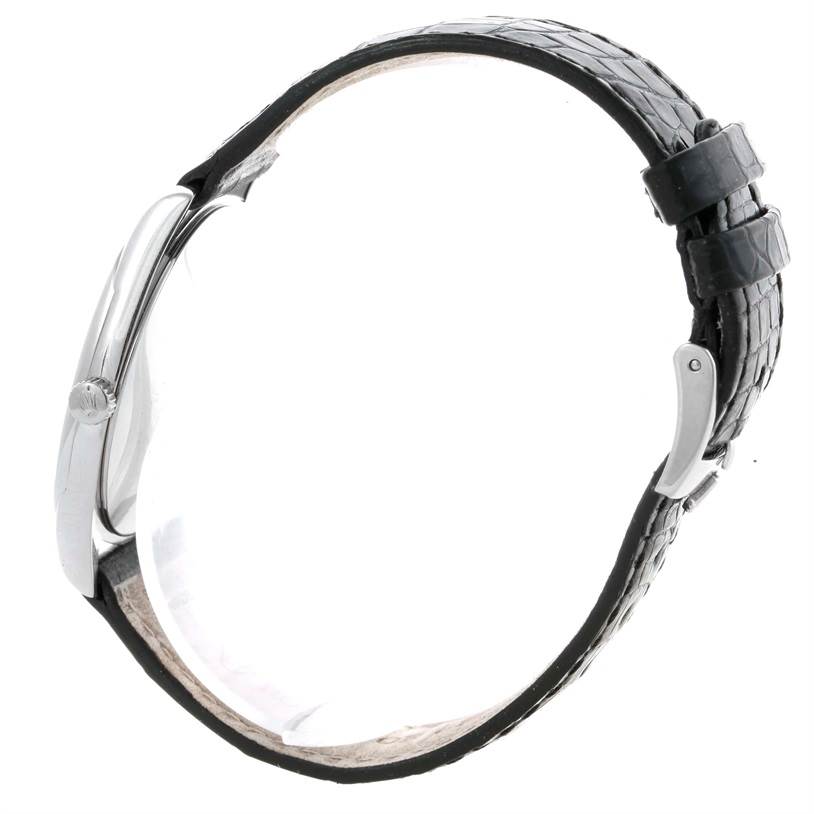 The image shows a side profile of a Rolex Cellini 4233 Men
s White Gold White Dial 4233 Men
s White Gold White Dial watch, highlighting the case, crown, and leather strap with a buckle.