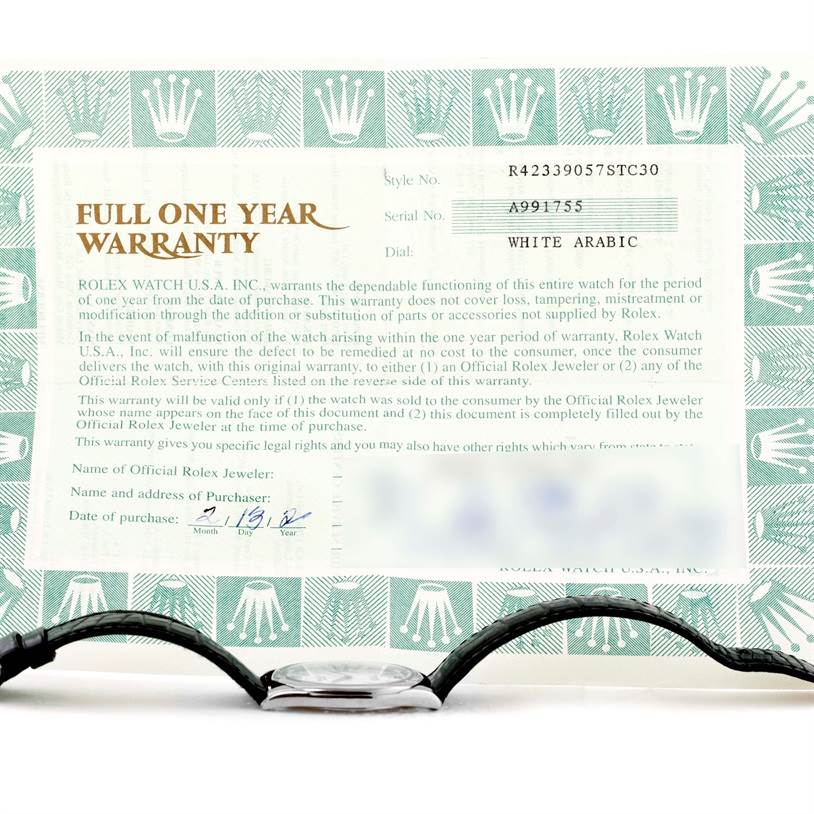 The image shows a side profile of the Rolex Cellini 4233 Men
s White Gold White Dial 4233 Men
s White Gold White Dial watch with its warranty card in the background.