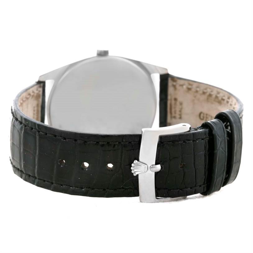 This image shows the back view of a Rolex Cellini 4233 Men
s White Gold White Dial 4233 Men
s White Gold White Dial watch, highlighting its black leather strap and metal buckle.