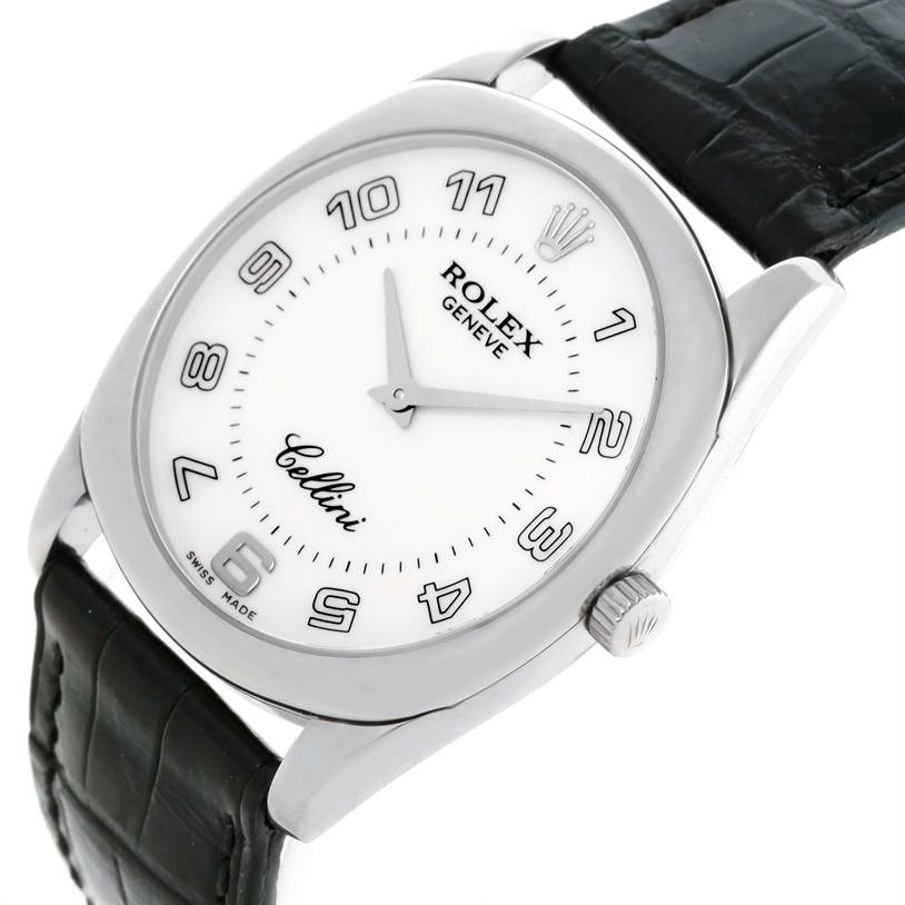 The image shows a Rolex Cellini 4233 Men
s White Gold White Dial 4233 Men
s White Gold White Dial watch from an angled view, showcasing the face, crown, and black leather strap.