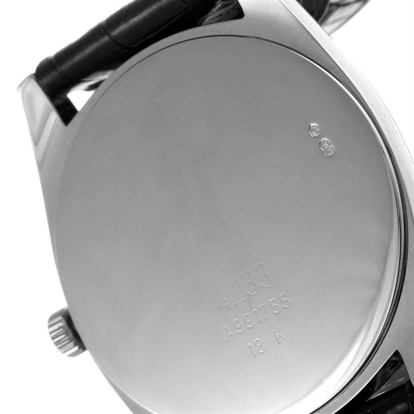 The image shows the back case of a Rolex Cellini 4233 Men
s White Gold White Dial 4233 Men
s White Gold White Dial watch, featuring the crown and part of the strap.
