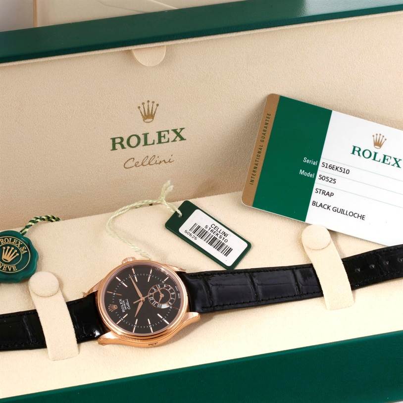 The Rolex Cellini 50525 Men's Rose Gold Black Dial 50525 Men's Rose Gold Black Dial watch is shown from the front, lying flat in an open box with tags and the guarantee card visible.
