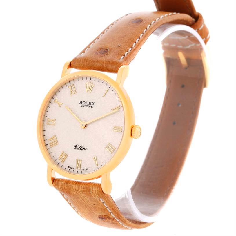 The image shows a Rolex Cellini 5112 Men's Yellow Gold Beige Dial 5112 Men's Yellow Gold Beige Dial watch at a three-quarter angle, highlighting its face, Roman numeral markers, and leather strap.