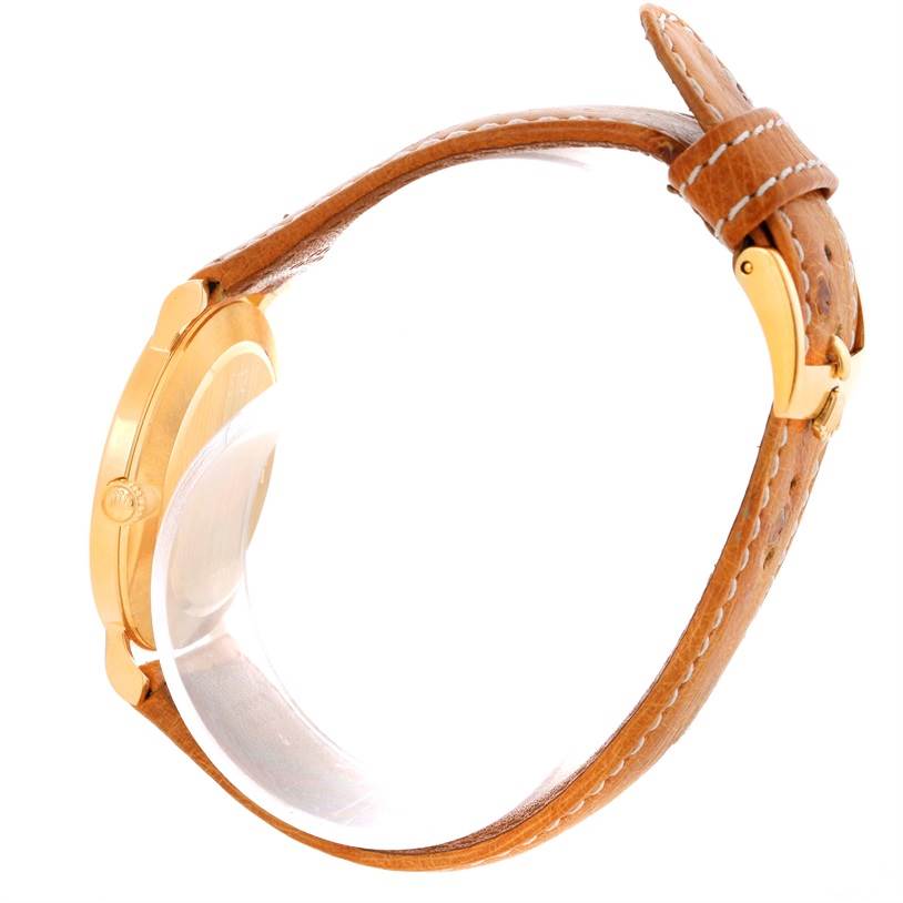 This image shows a side view of the Rolex Cellini 5112 Men's Yellow Gold Beige Dial 5112 Men's Yellow Gold Beige Dial watch, highlighting its leather strap and clasp.