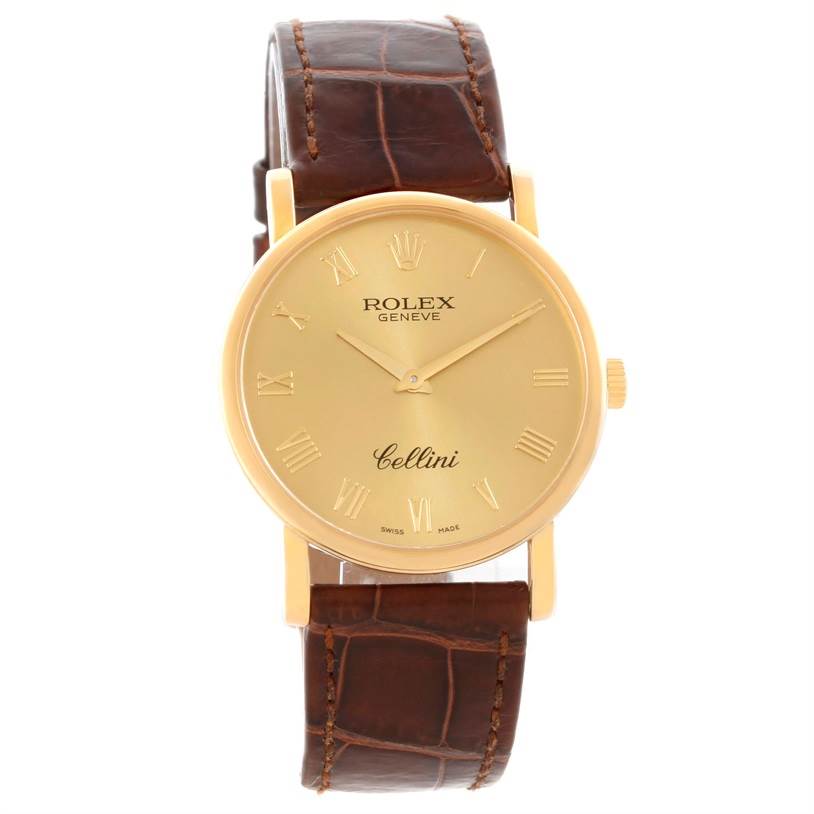 This image shows a full frontal view of a Rolex Cellini 5115 Men
s Yellow Gold Champagne Dial 5115 Men
s Yellow Gold Champagne Dial watch with a brown leather strap and a gold dial.