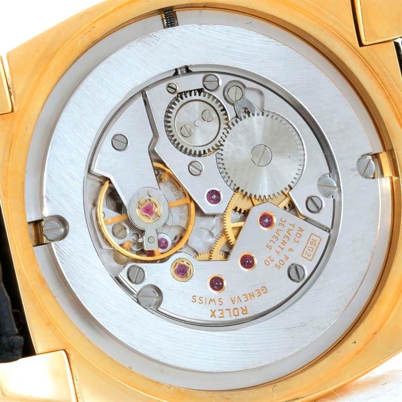 The image shows an angled view of the movement mechanism of a Rolex Cellini 5330 Men's Yellow Gold White Dial 5330 Men's Yellow Gold White Dial watch, highlighting gears and components inside.