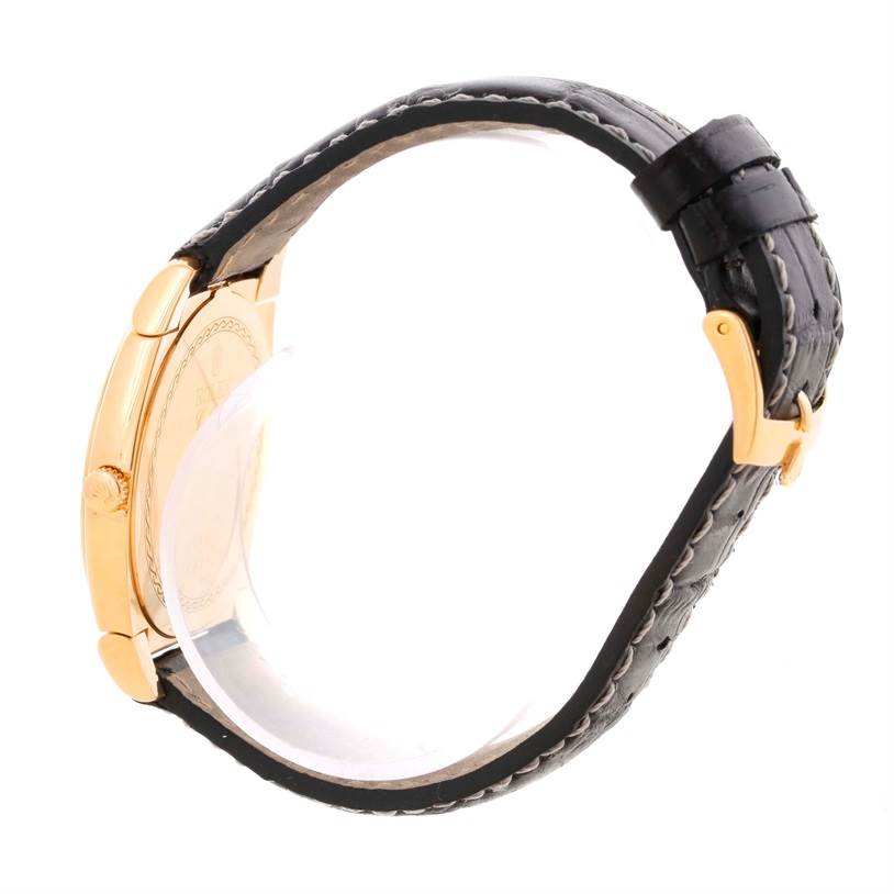 The image shows a side view of the Rolex Cellini 5330 Men's Yellow Gold White Dial 5330 Men's Yellow Gold White Dial watch, highlighting its case, crown, and leather strap.