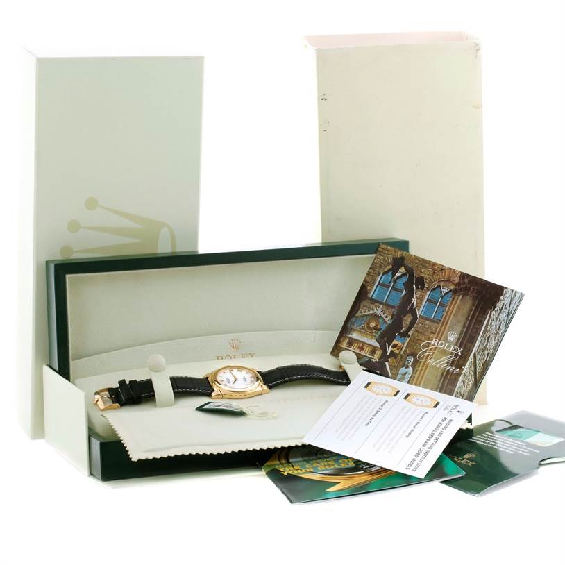 The Rolex Cellini 5330 Men's Yellow Gold White Dial 5330 Men's Yellow Gold White Dial watch is shown in its open box with instruction booklets and accessories.
