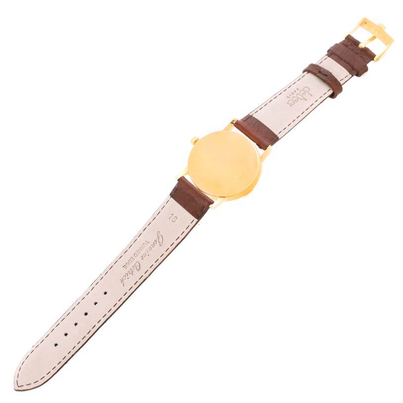 This image shows the back side of a Rolex Cellini 5115 Men
s Yellow Gold Silver Dial 5115 Men
s Yellow Gold Silver Dial watch, including the strap and buckle.