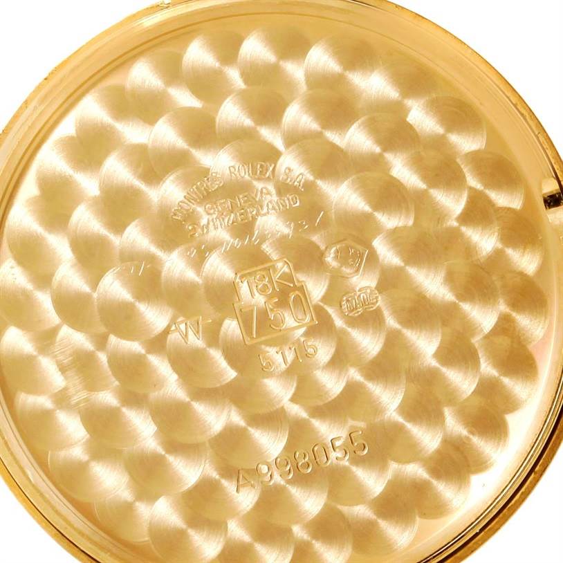 This is the inside case back of a Rolex Cellini 5115 Men
s Yellow Gold Silver Dial 5115 Men
s Yellow Gold Silver Dial watch, showing markings and hallmarks.