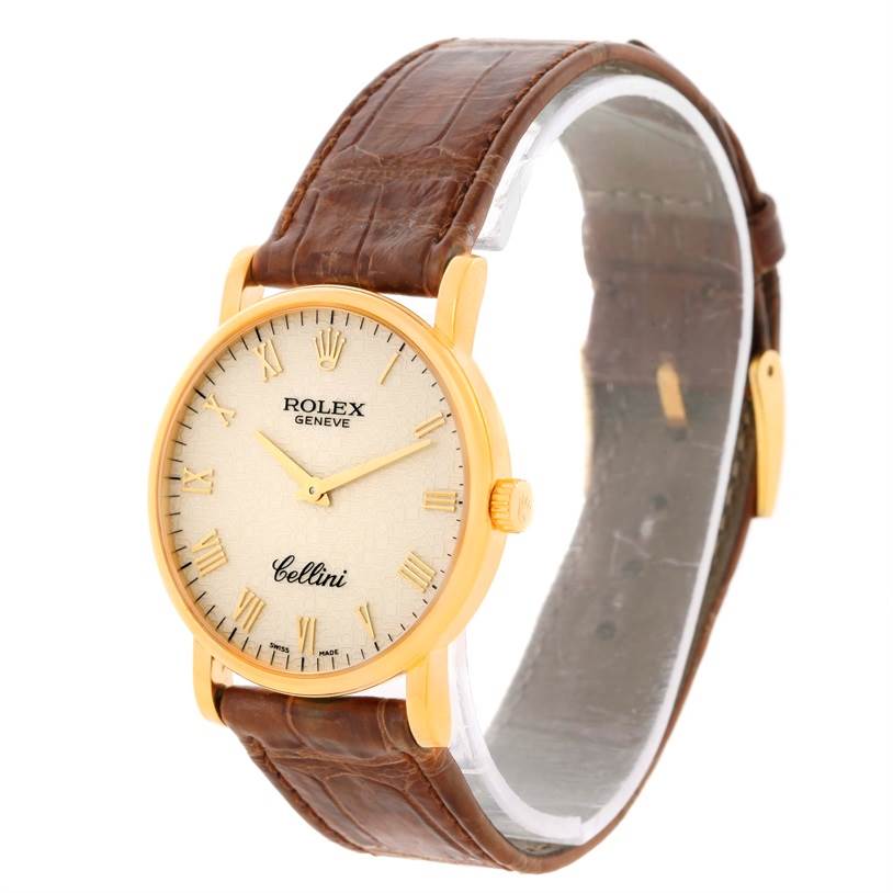 The Rolex Cellini 5115 Men
s Yellow Gold Beige Dial 5115 Men
s Yellow Gold Beige Dial watch is shown at a slight side angle, highlighting the face, bezel, crown, and brown leather strap.