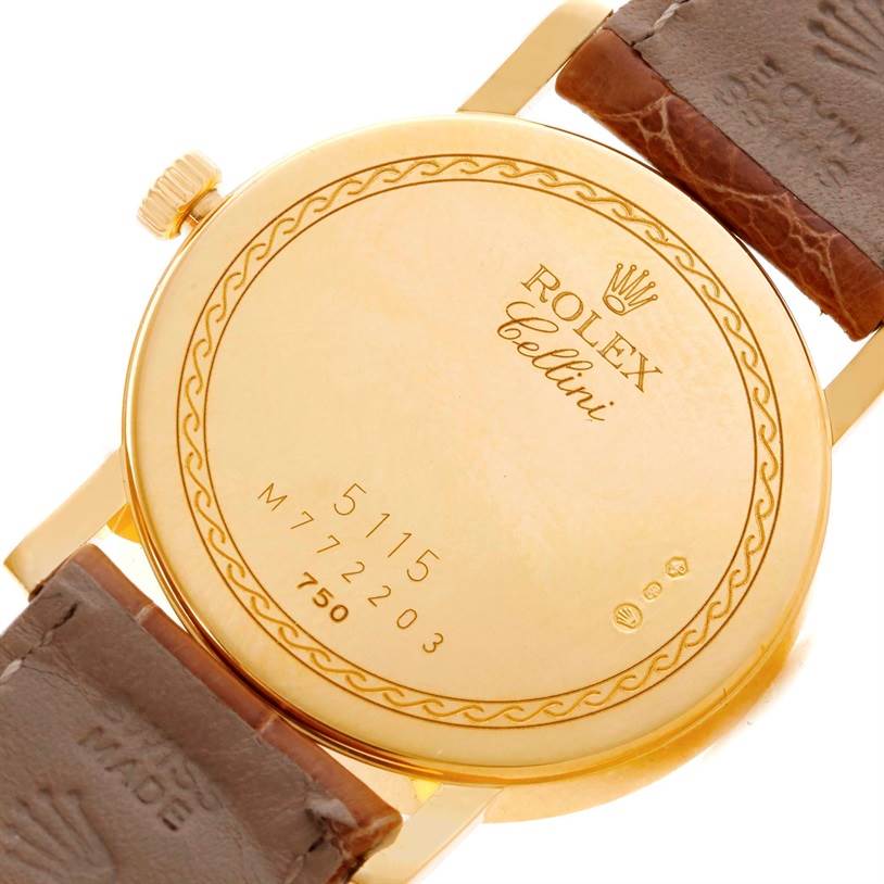 This image shows the back case and part of the leather strap of a Rolex Cellini 5115 Men
s Yellow Gold Champagne Dial 5115 Men
s Yellow Gold Champagne Dial model watch.