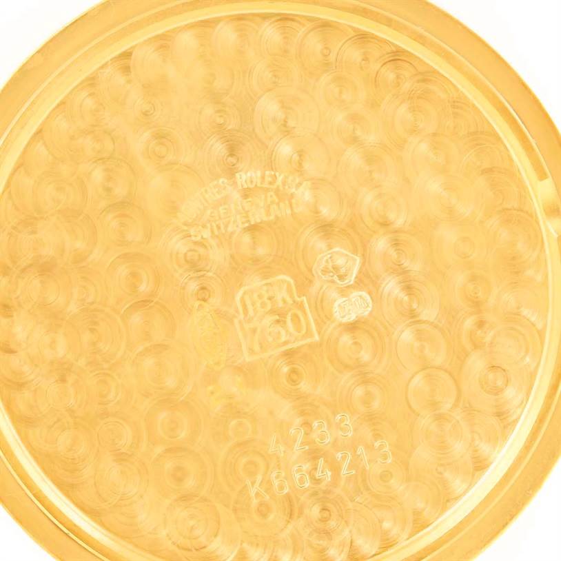 The image shows the interior back case of a Rolex Cellini 4233 Men's Yellow Gold White Dial 4233 Men's Yellow Gold White Dial watch, featuring engravings and hallmarks.