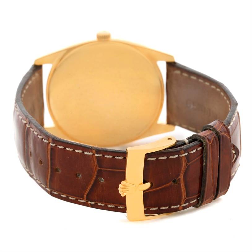 The image shows the Rolex Cellini 4233 Men's Yellow Gold White Dial 4233 Men's Yellow Gold White Dial model from the rear, highlighting the back case and leather strap with the buckle.